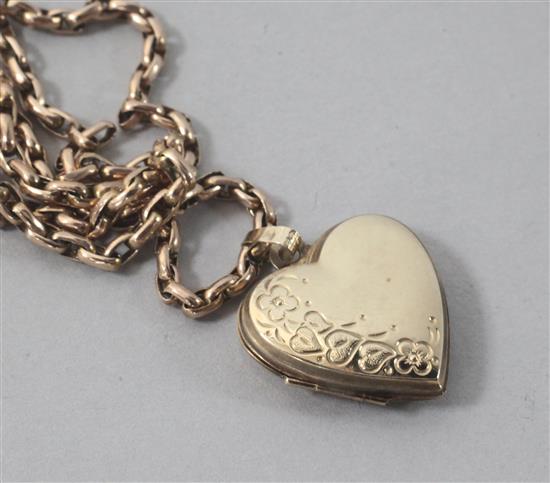 A 9ct gold heart shaped locket, on a 9ct gold chain, locket 18mm.